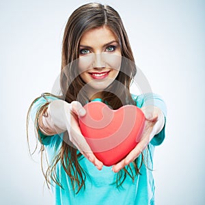 Red heart. Love symbol. Portrait of beautiful woman hold Valent