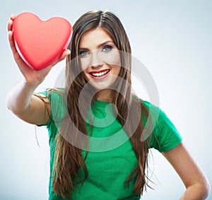 Red heart. Love symbol. Portrait of beautiful woman hold Valent