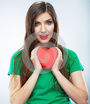 Red heart. Love symbol. Portrait of beautiful woman hold Valent