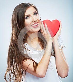 Red heart. Love symbol. Portrait of beautiful woman hold Valent