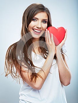 Red heart. Love symbol. Portrait of beautiful woman hold Valent