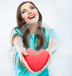 Red heart. Love symbol. Portrait of beautiful woman hold Valent