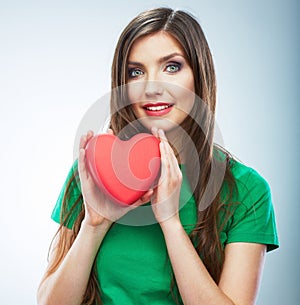 Red heart. Love symbol. Portrait of beautiful woman hold Valent