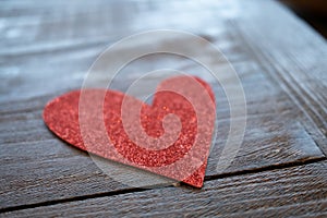 Red Heart Made from Glitter on a Wooden Surfaced Table