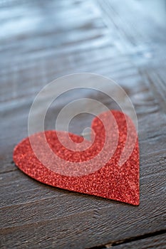 Red Heart Made from Glitter on a Wooden Surfaced Table photo