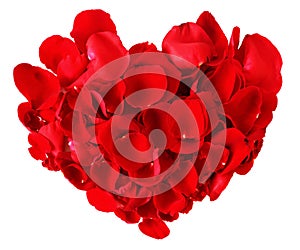 Red heart made from rose petals isolated on white background