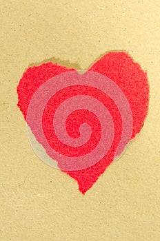 Red heart on paperbackground