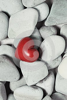 Red heart on pebble stones, still life. Valentines day and lovers background