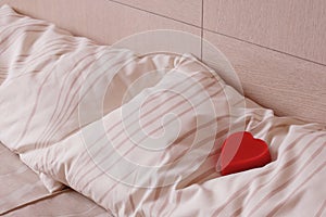 Red heart on pillow. Love and romance symbol.