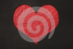 Red heart, red crumpled leather and black leather texture background