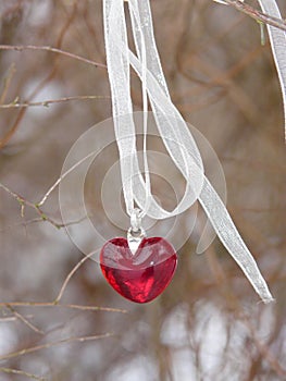 Red heart with ribbon shows lonely times photo