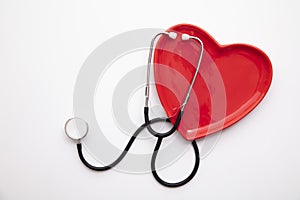 Red heart shape with a stethoscope. Healthy heart concept