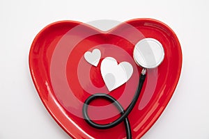 Red heart shape with a stethoscope. Healthy heart concept