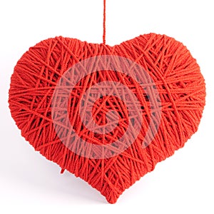 Red heart shape symbol made from wool