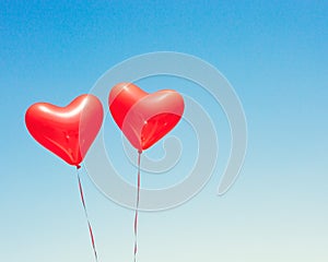 Red heart shaped balloons