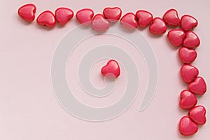 Red heart-shaped beads are located in the upper right corner on a pink background, mock-up for design
