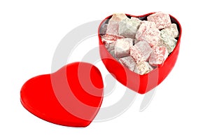 Red heart-shaped box of Turkish delight isolated