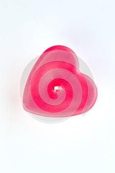 Red heart shaped candle, top view.