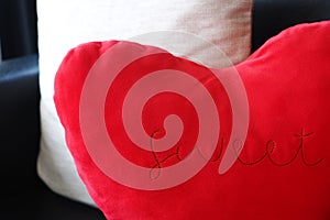 Red heart shaped cushion with sweet word