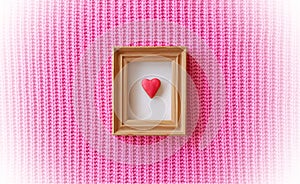 Red Heart-Shaped Gingerbread. Wooden Frame. Handmade Knitted Pink Background. Flat lay Composition. White Vignette