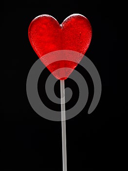 Red heart-shaped lollypop