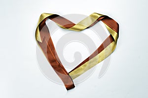 Red heart shaped ribbon  on white background