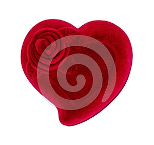 Red heart-shaped velvet candy box for Valentines day gift. Closed box for wedding ring with rose flower image