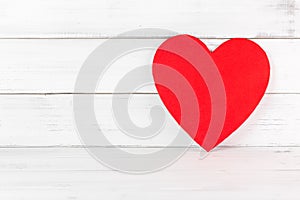 Red Heart Shaped on white wood background. Love Concept with Copy Space