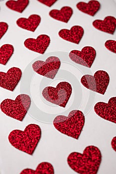 red heart shapes on the white background in valentine\'s day