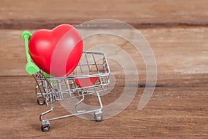 Red heart sign in shopping cart