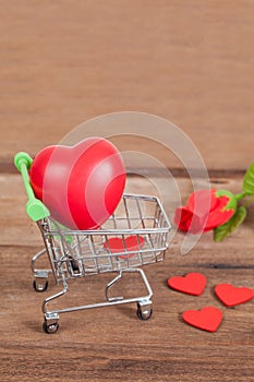 Red heart sign in shopping cart