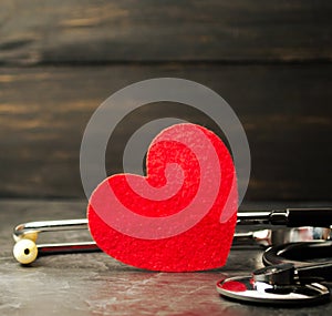 Red heart and stethoscope. The concept of medicine and health insurance, family, life. Ambulance. Cardiology Healthcare