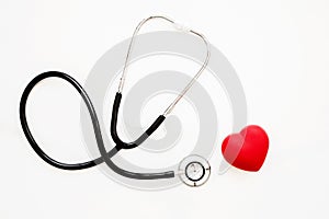 Red heart and a stethoscope on white background