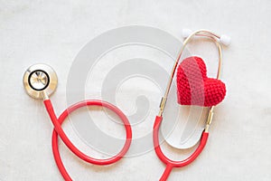 Red heart and stethoscope on white isolated background, copy space. Concept for heart health, cardiology, insurance plan, organ