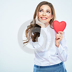 Red heart symbol of Valentines day smiling woman hold.