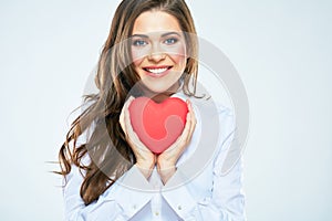 Red heart symbol of Valentines day smiling woman hold.