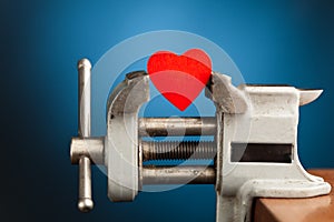 Red heart in the vice tool