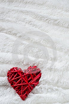 Red heart on the white pelage for Valentine day