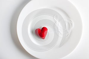 Red heart on a white plate. concept. Valentine, beautiful background