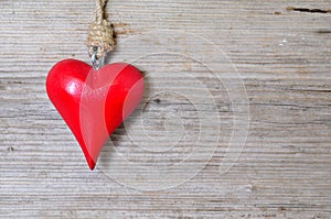 Red heart on wood