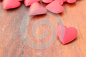 Red heart on wood background