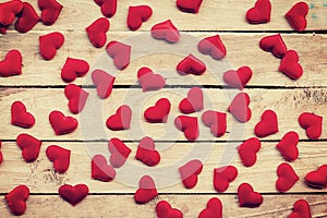 Red heart on wood background with vintage toned