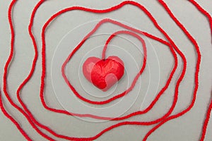 Red heart wrapped around with rope