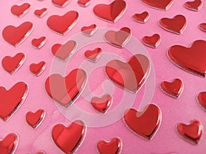 Red hearts background on a pink backdrop
