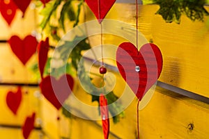 Red hearts on a background of wood with leaves. The 14th of February photo