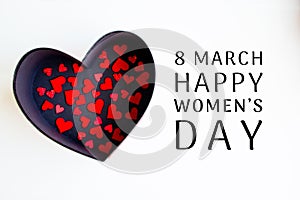 Red hearts in a black box with a heart and Happy 8 March International Women`s Day lettering