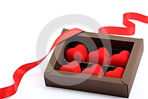 Red hearts in brown box