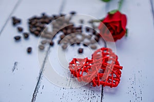 Red hearts and flowers on a white wood floor with space, ideas love or the day of love Valentines Day.