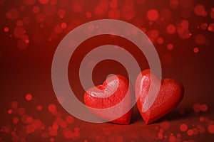 Red hearts on glitter background