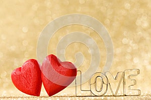 Red hearts on glitter background